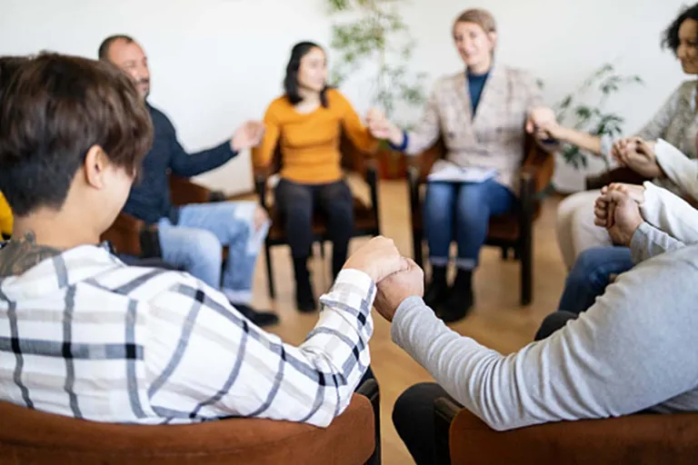 Supportive family discusses addiction treatment at a meeting in Savannah, GA.
